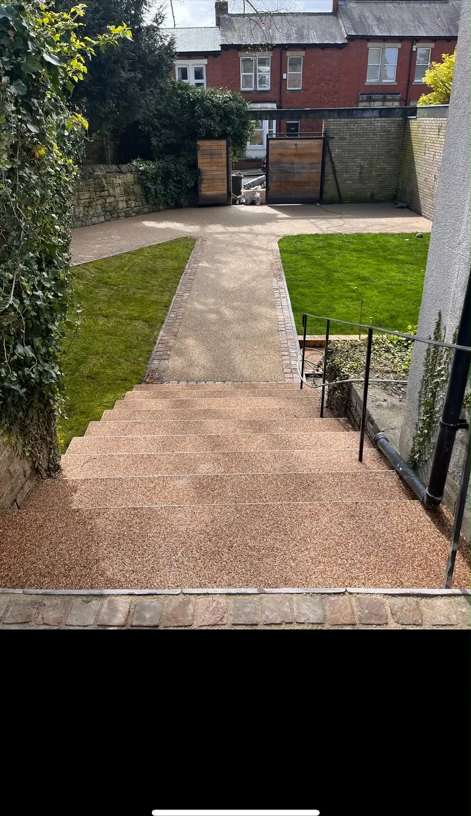 Completed resin bound steps and pathway running through a landscaped Newcastle garden