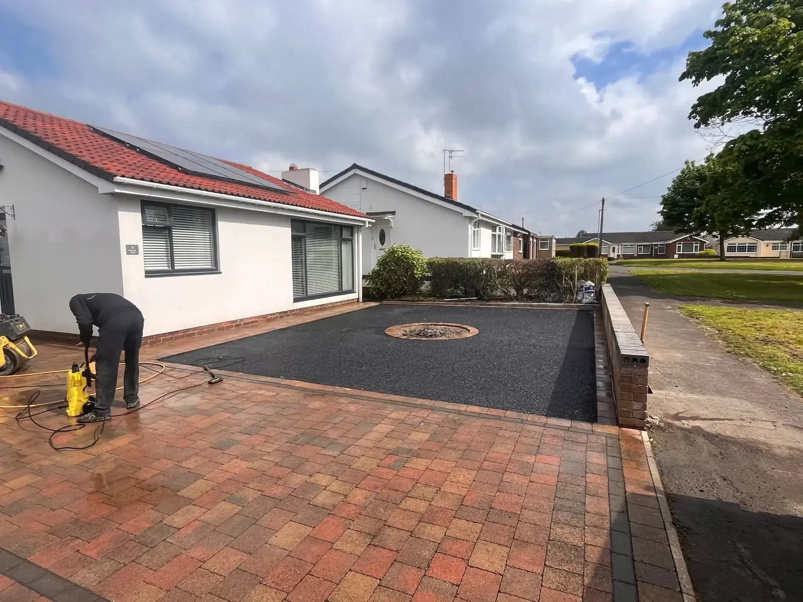 Driveway base build with a circular centre feature being formed before final surfacing